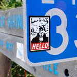 goatse obey sticker on a road sign