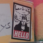 Bathroom stall Goatse sticker at The Aquarium, Fargo, ND